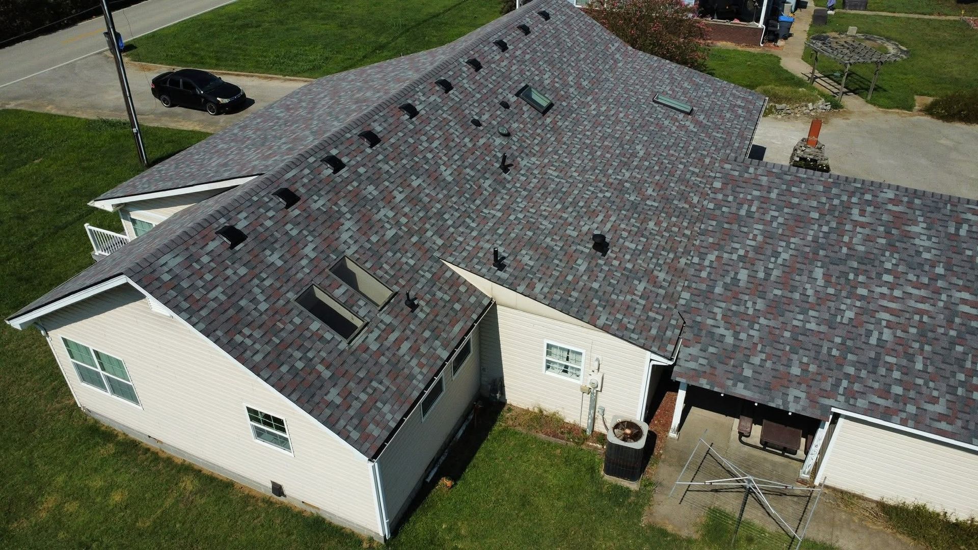 A large house with a truck parked in front of it.