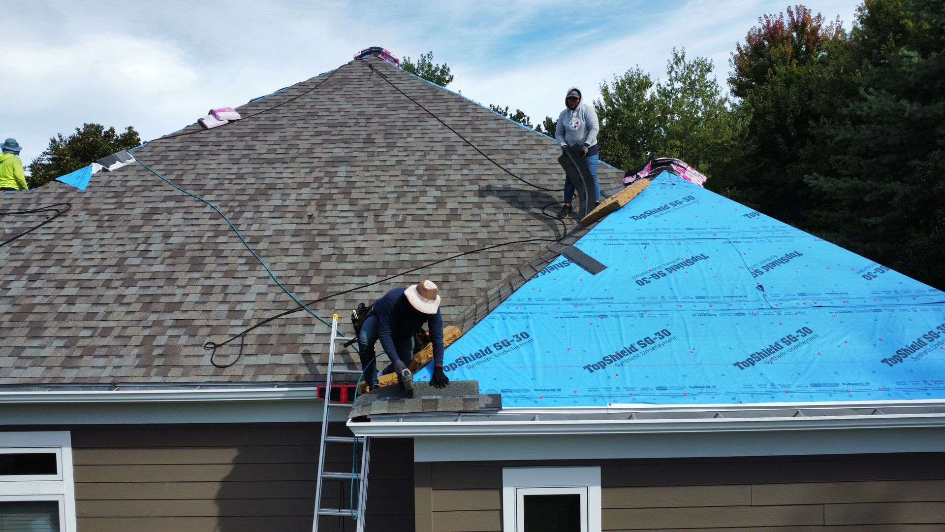 The back of a house with a deck and stairs.
