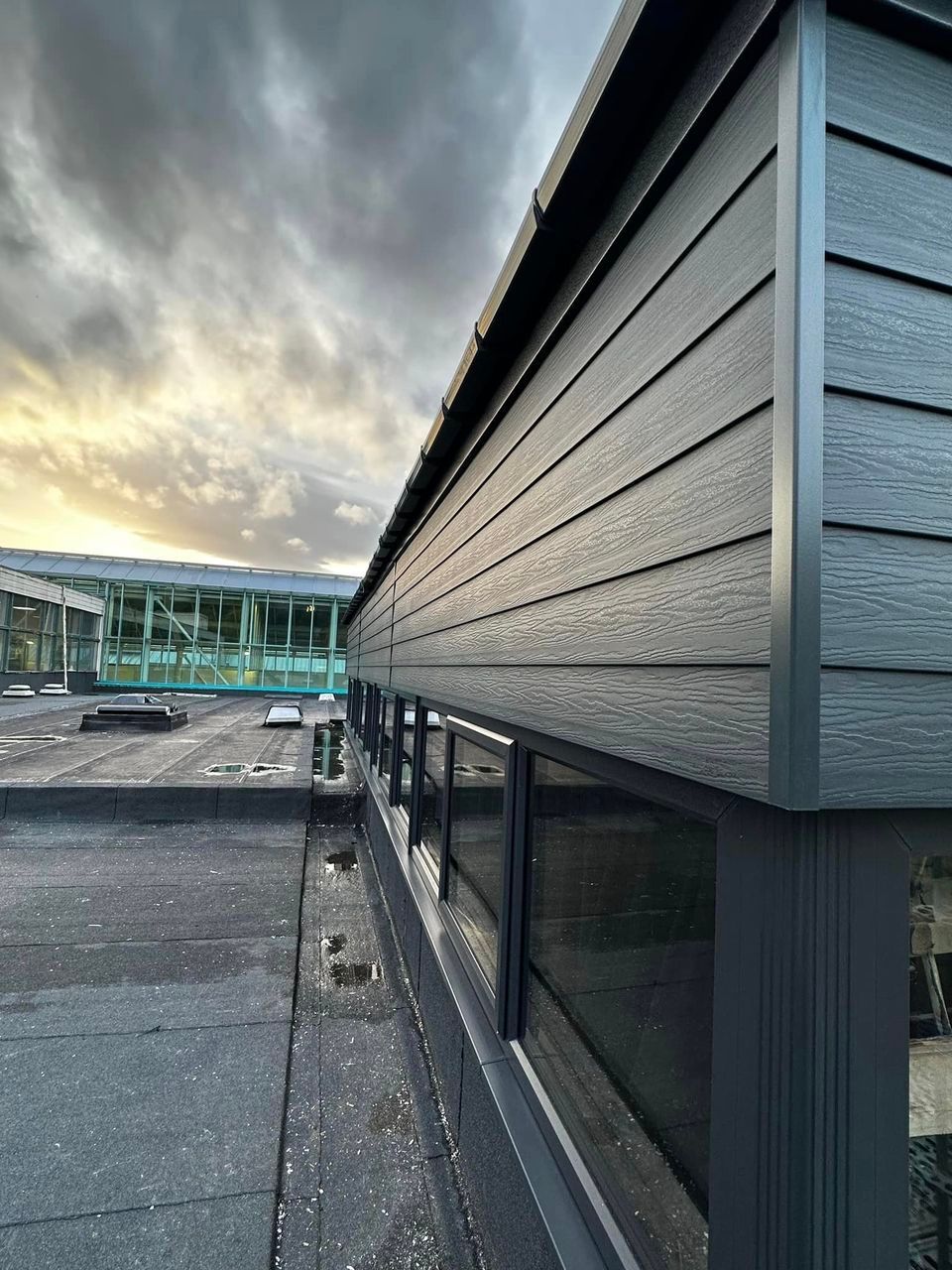 Anthracite grey cladding fitted to commercial building