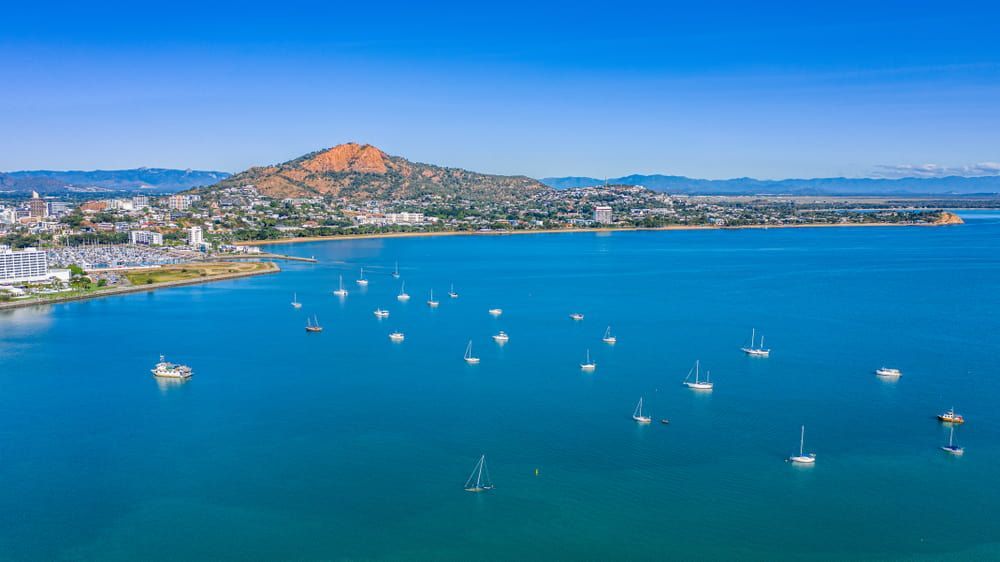 An Aerial View of a Large Body of Water With Boats in It — Cairns Electrical Rewinds & Repairs In Townsville, QLD
