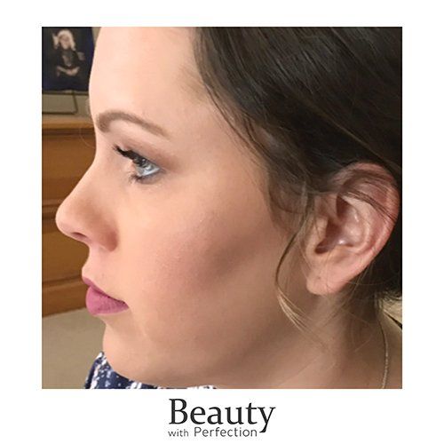 A close up of a woman 's face with makeup on.