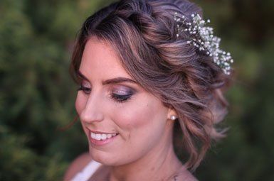 A close up of a woman wearing a headpiece in her hair.