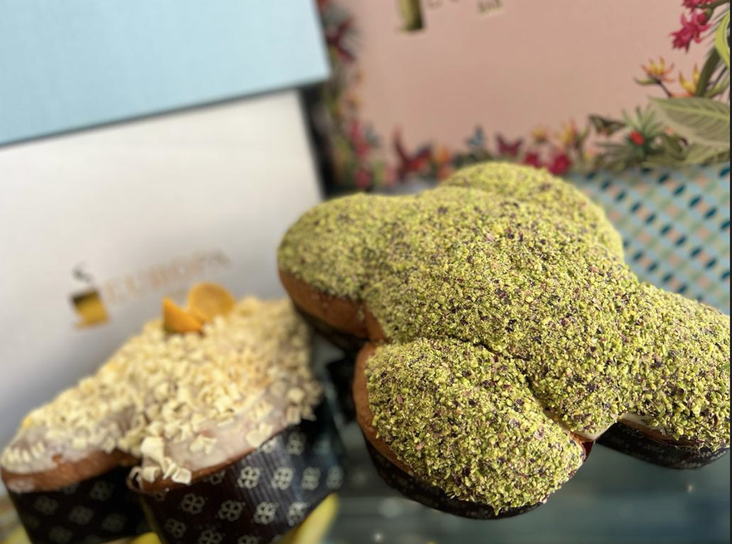 Un primo piano di una colomba con pistacchi sopra