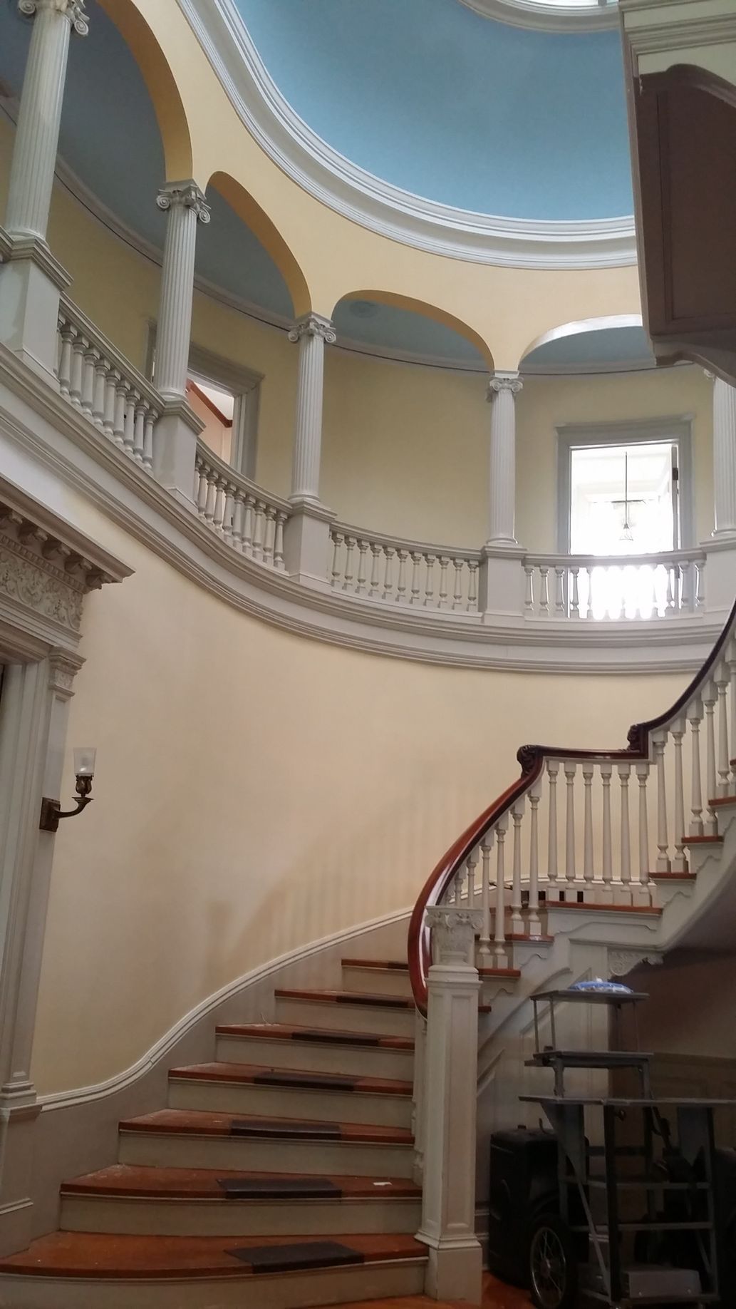 A spiral staircase in a building with a dome ceiling.