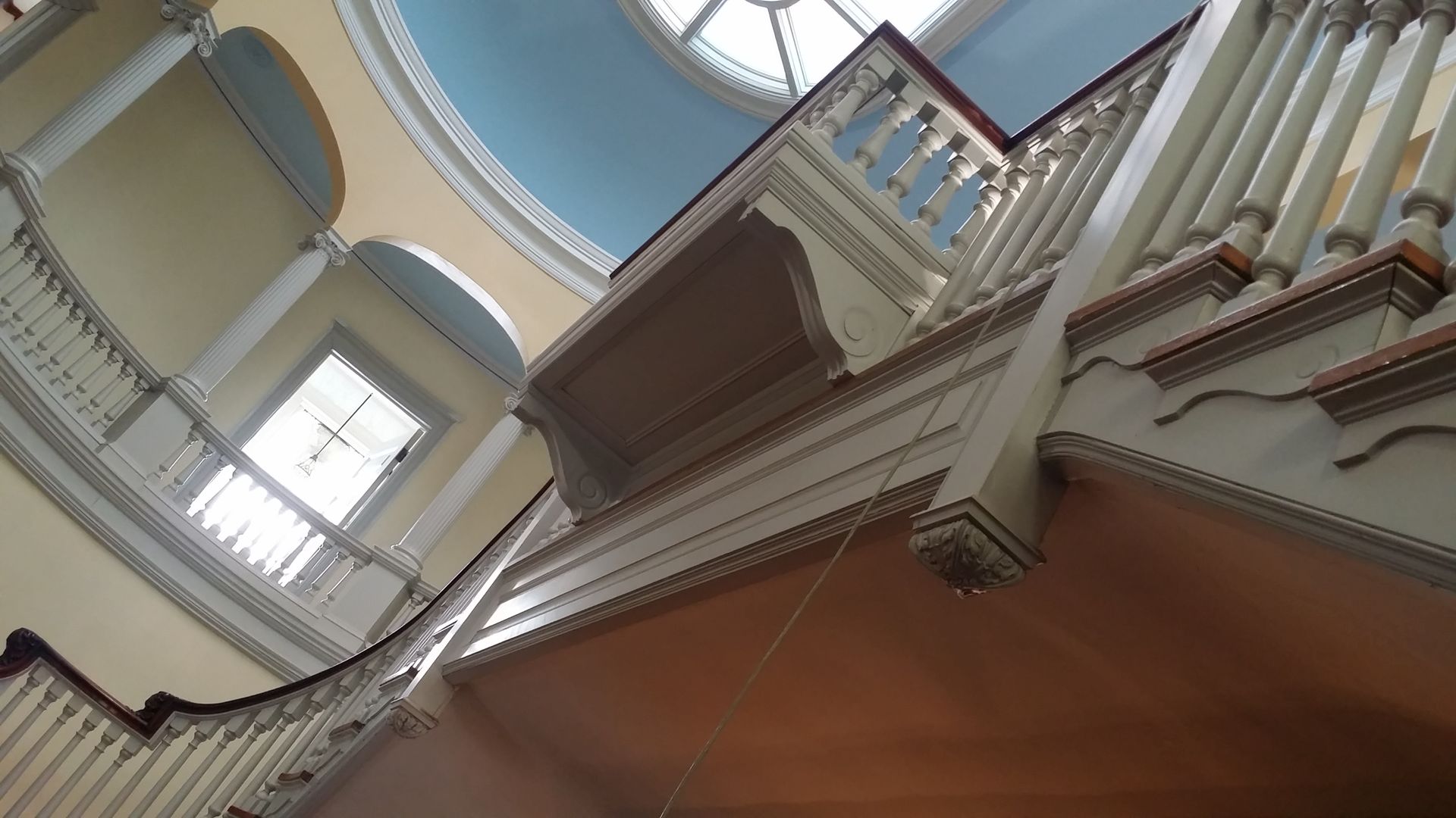 Looking up at a balcony in a building