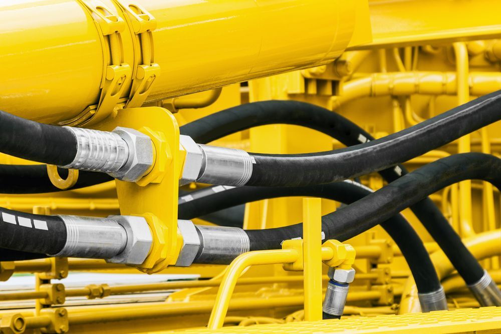 Close-up Of Black Industrial Hydraulic Hoses — Eastcoast Bearings & Hydraulics in Yamba, NSW