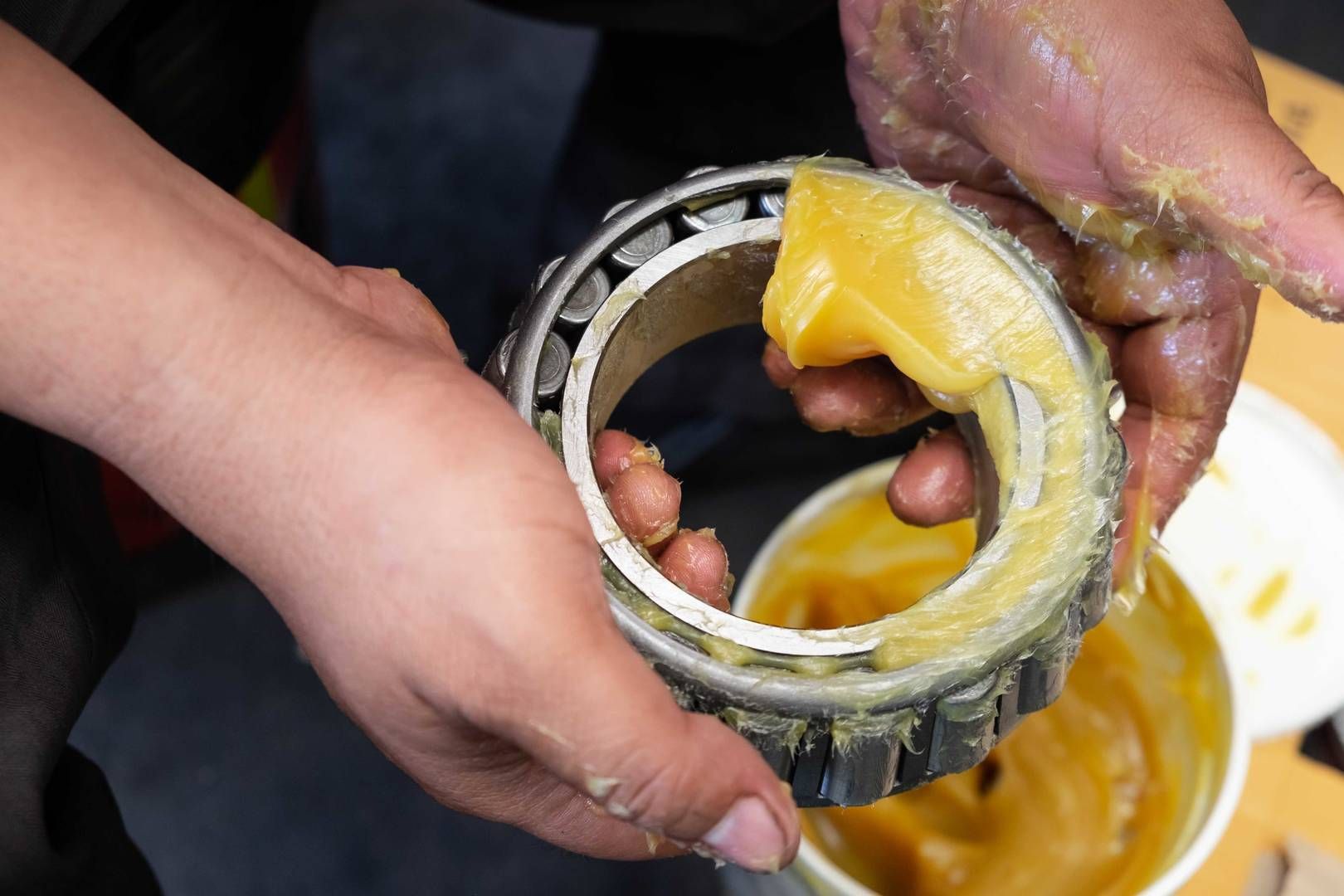 A Gloved Finger Scoops A Thick, Golden-yellow Lubricant Grease — Eastcoast Bearings & Hydraulics in South Grafton, NSW