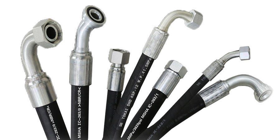 Assorted black industrial hoses with metal couplings — Eastcoast Bearings & Hydraulics in South Grafton, NSW