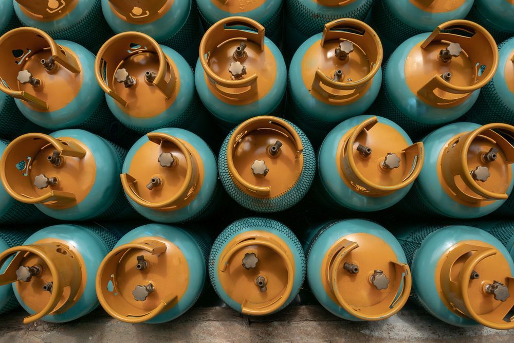 A High-angle View Of Many Identical Blue Gas Cylinders — Eastcoast Bearings & Hydraulics in South Grafton, NSW