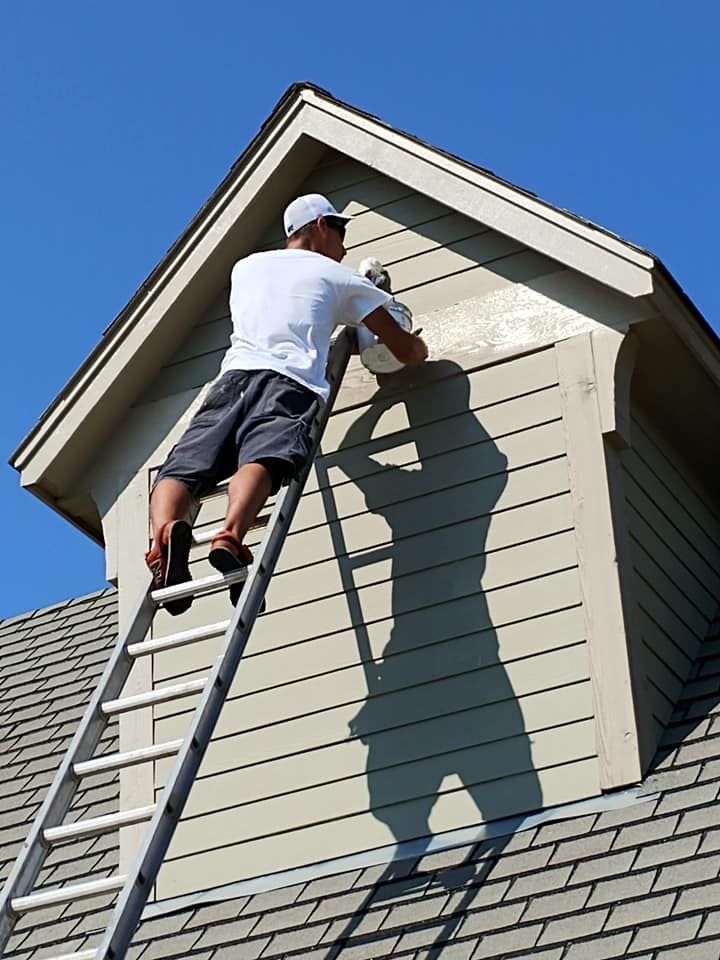 Residential painter working on a property in Oklahoma