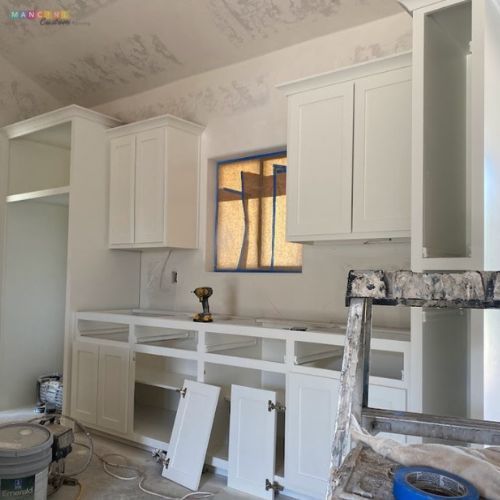 Cabinet painted white during a Stillwater house contruction