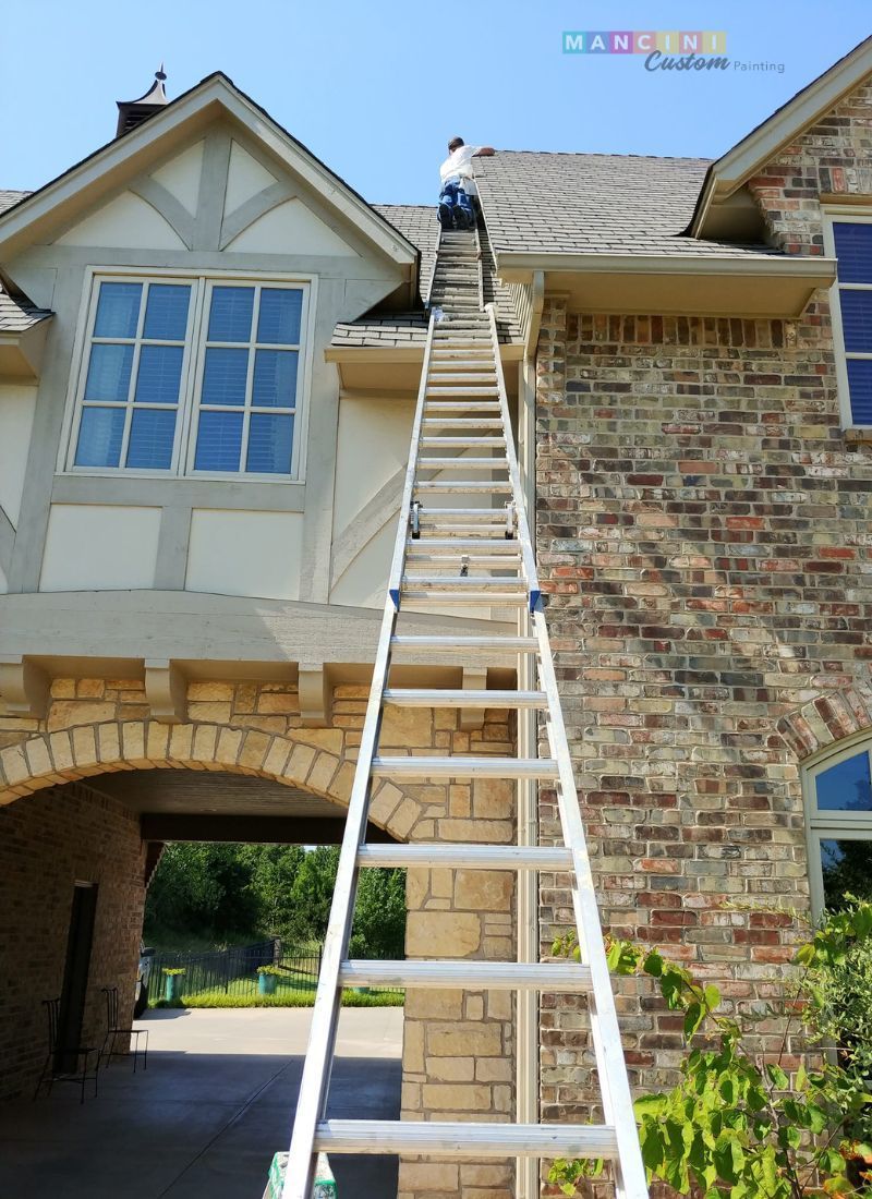 Painter working on a commercial property in Stillwater, OK