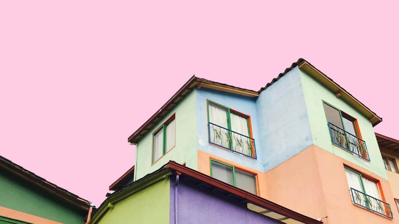 Colorful house in a vibrant cityscape.