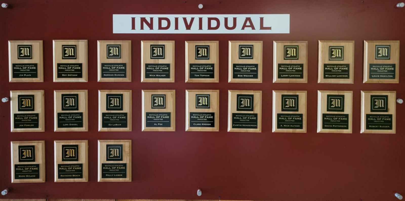 A wall with individual plaques on it