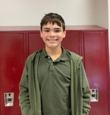 A young man smiling for the camera