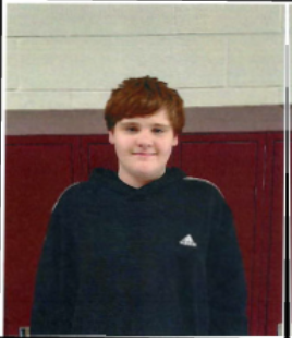 A young man smiling for the camera