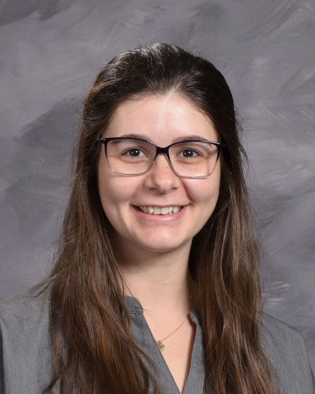 Woman wearing glasses smiling for the camera