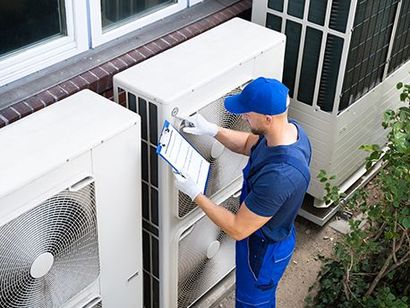 Electrician Checking Air Conditioning Unit — Staten Island, NY — Cool Off HVAC