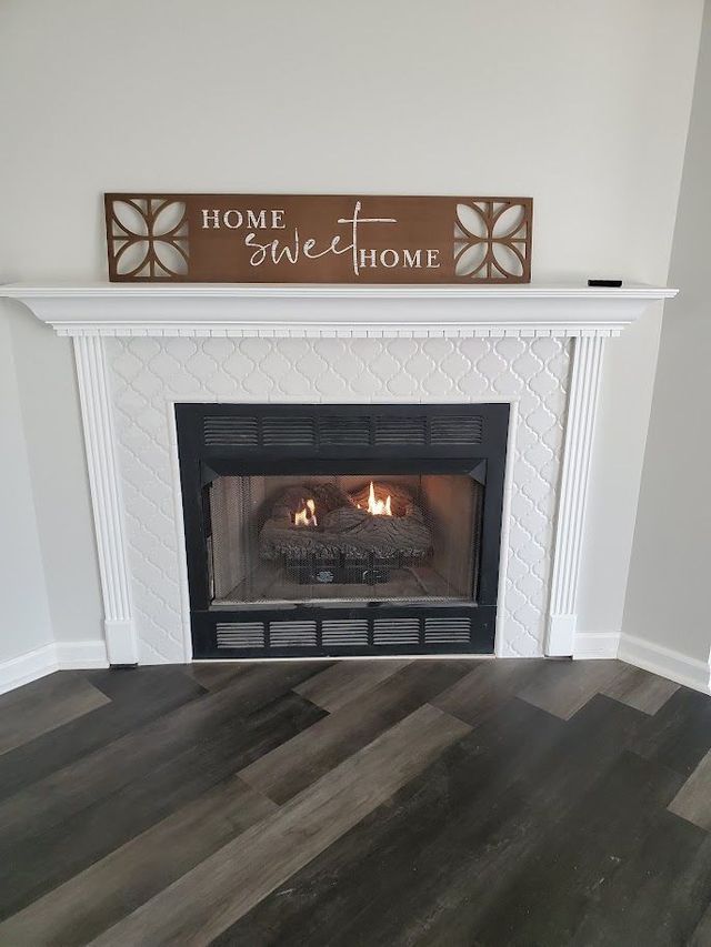 A fireplace with a sign above it that says `` home sweet home ''.