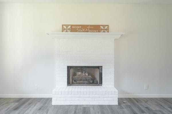 There is a fireplace in the middle of the room.