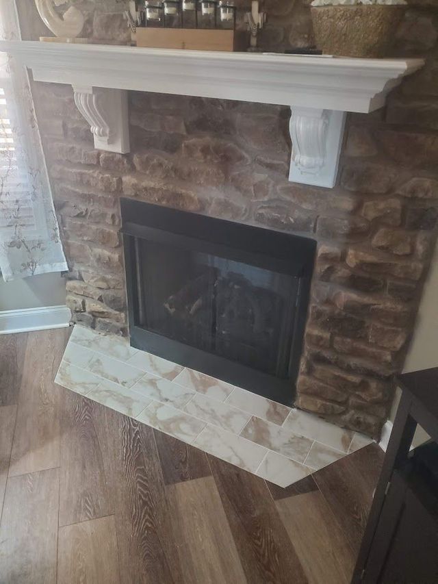 There is a fireplace in the middle of the room.