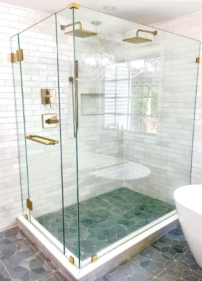 A bathroom with a walk in shower and a bathtub