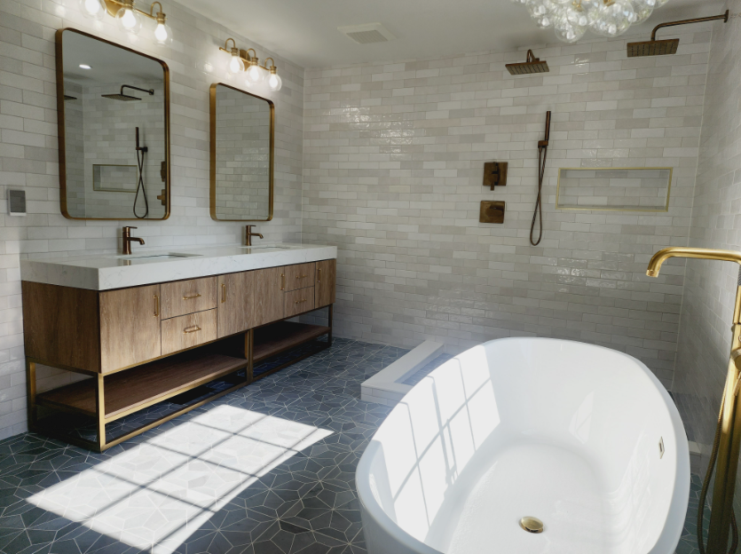 A bathroom with two sinks and a bathtub