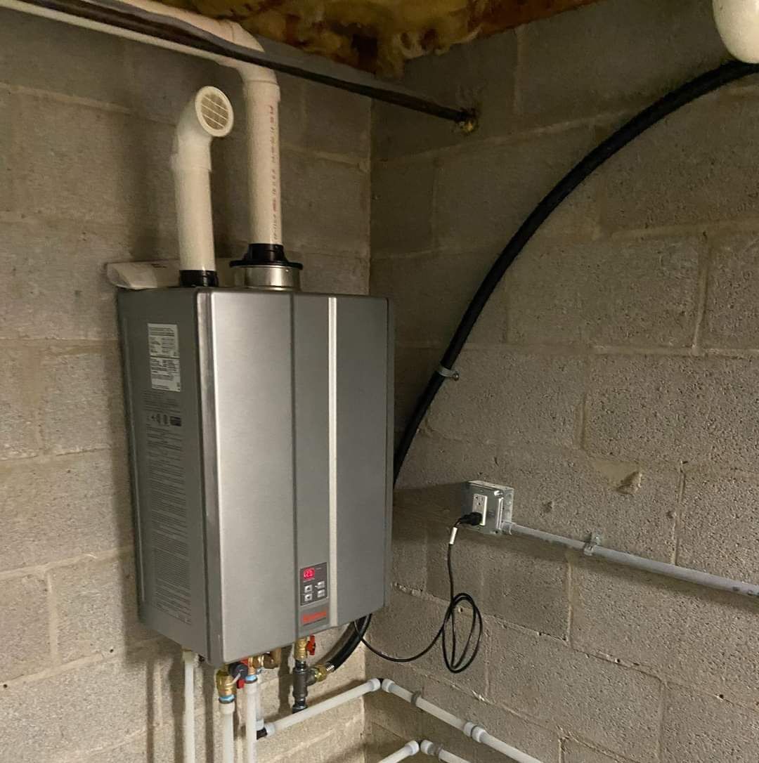 A Water Heater is Hanging on a Brick Wall in a Basement