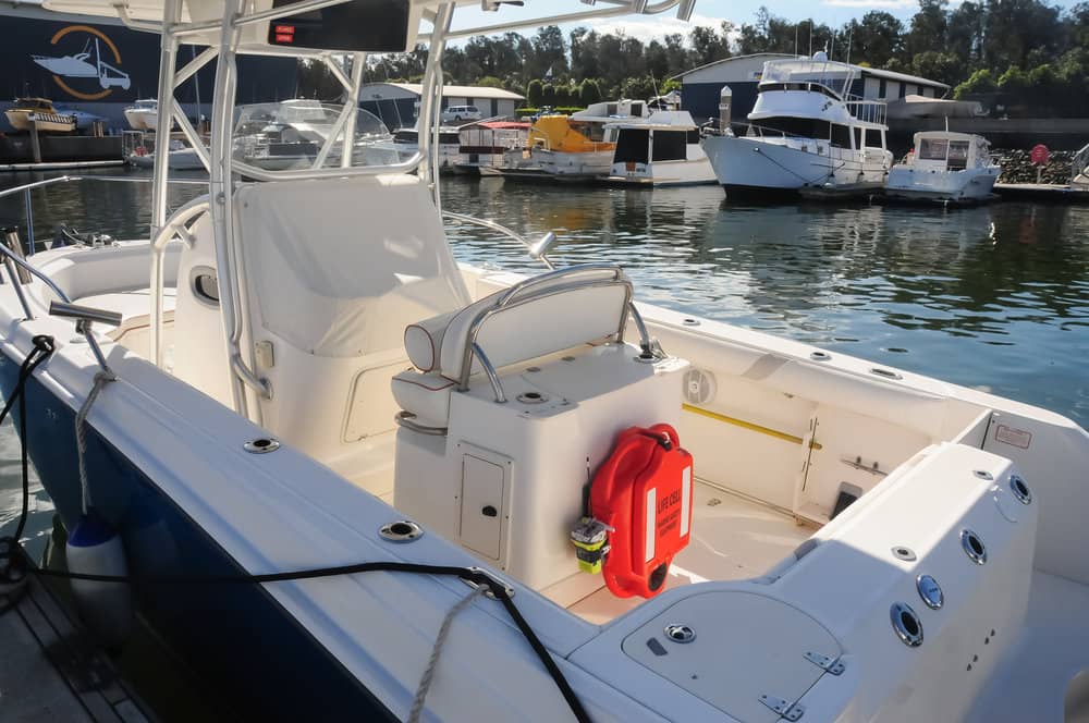 A boat is docked in a marina with boats in the background LIFECELL products
