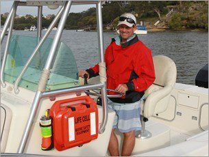 A man in a red jacket is driving a boat LIFECELL products