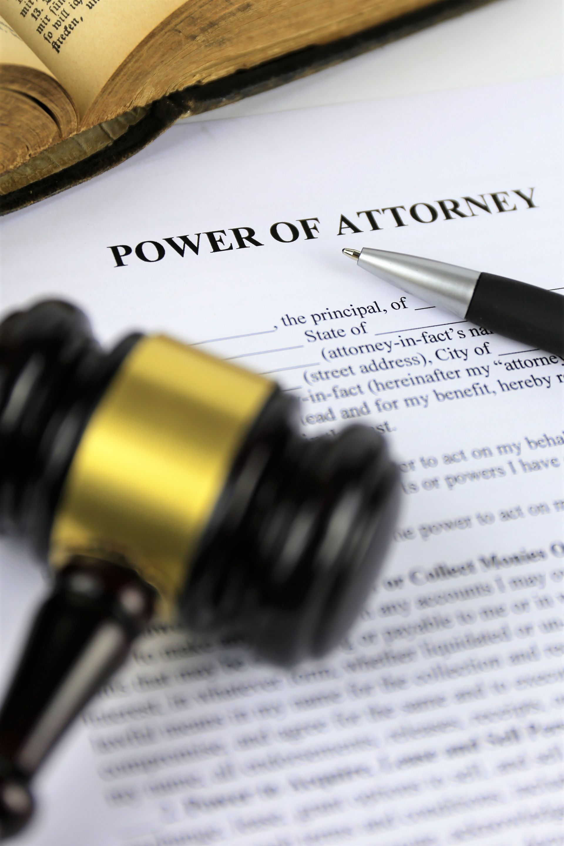 A Gavel is Sitting on Top of a Power of Attorney Form