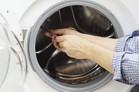 Repairman Repairing Laundry Appliances — Appliances in Gary, IN