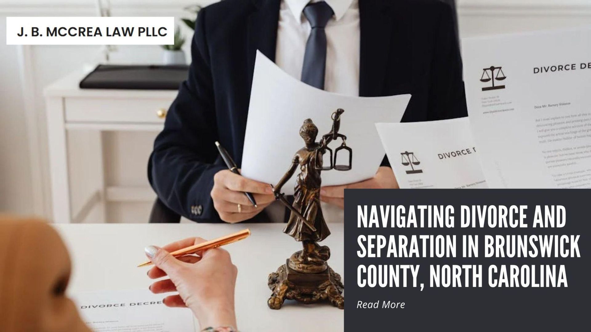 Attorney reviewing divorce documents with a client at a desk, highlighting legal guidance for divorc