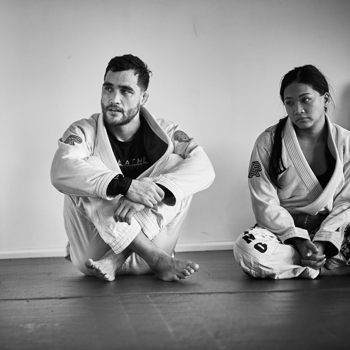 Adults drilling Brazilian Jiu Jitsu fundamentals at Breathe Jiu Jitsu in Yaphank, NY for fitness.
