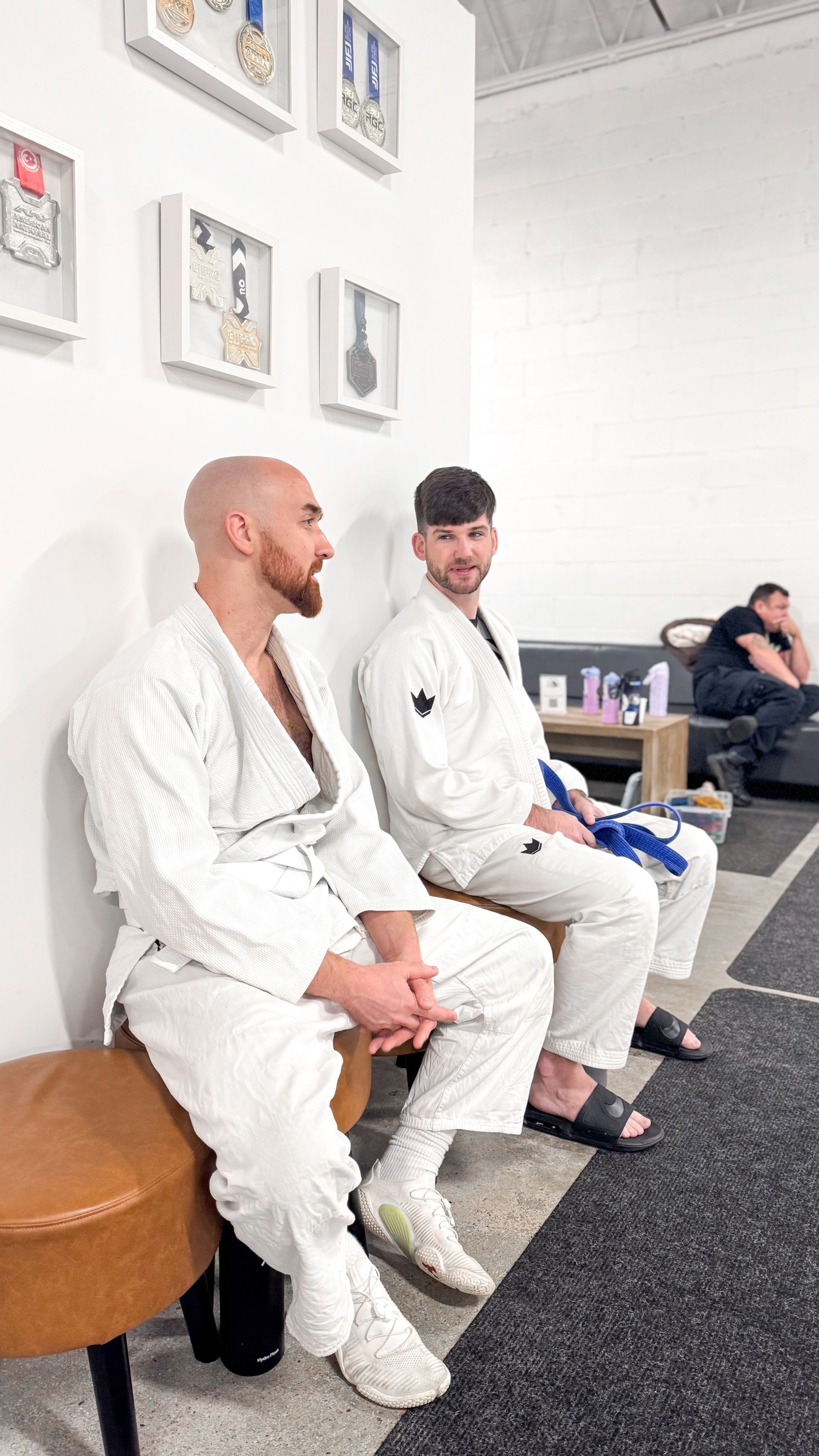 Adults practicing Brazilian Jiu Jitsu drills at Breathe Jiu Jitsu in Yaphank, NY for stress relief and fitness.