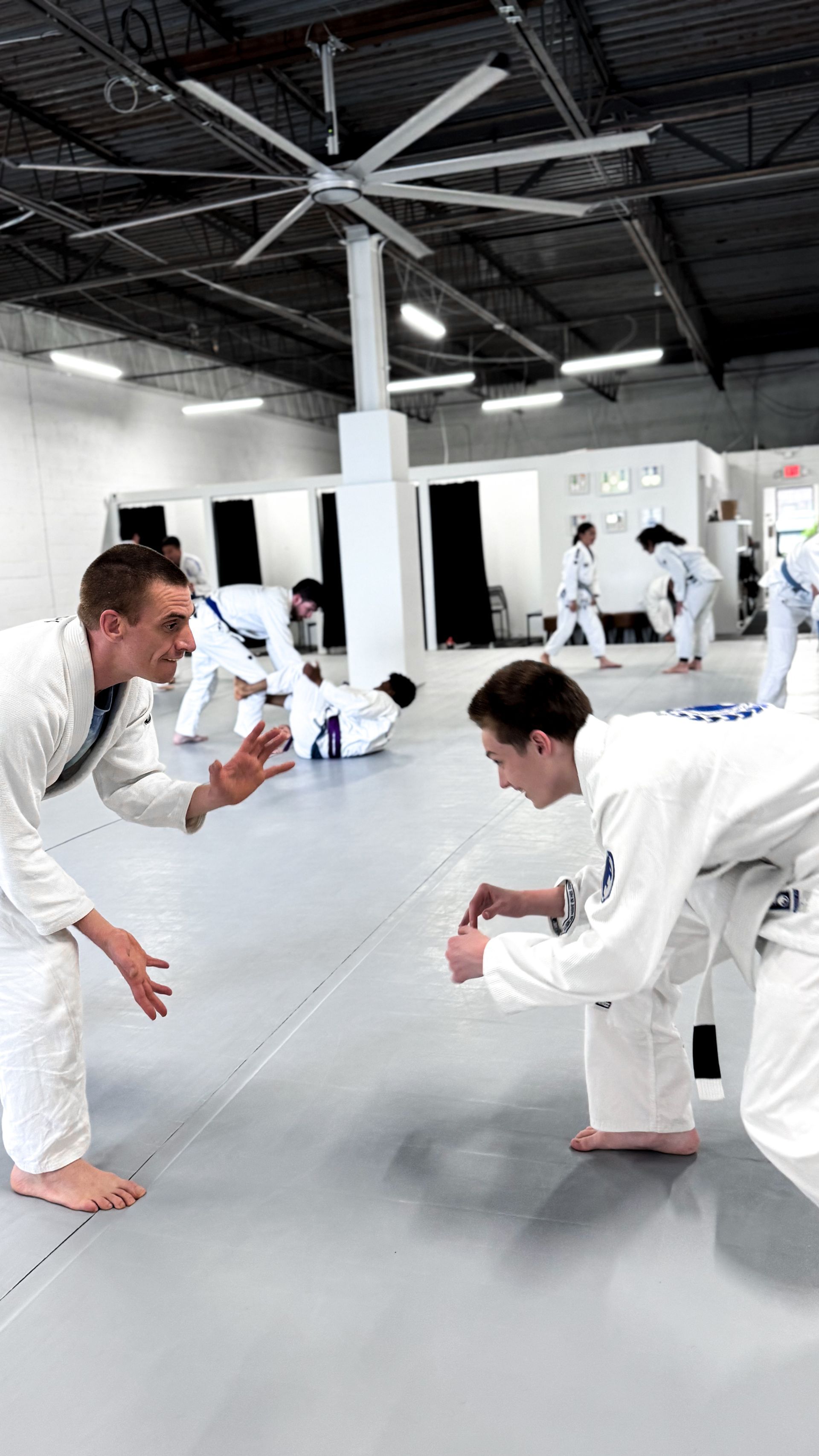 Adult students practicing controlled Jiu Jitsu drills at Breathe Jiu Jitsu in Yaphank, NY to build calm focus.
