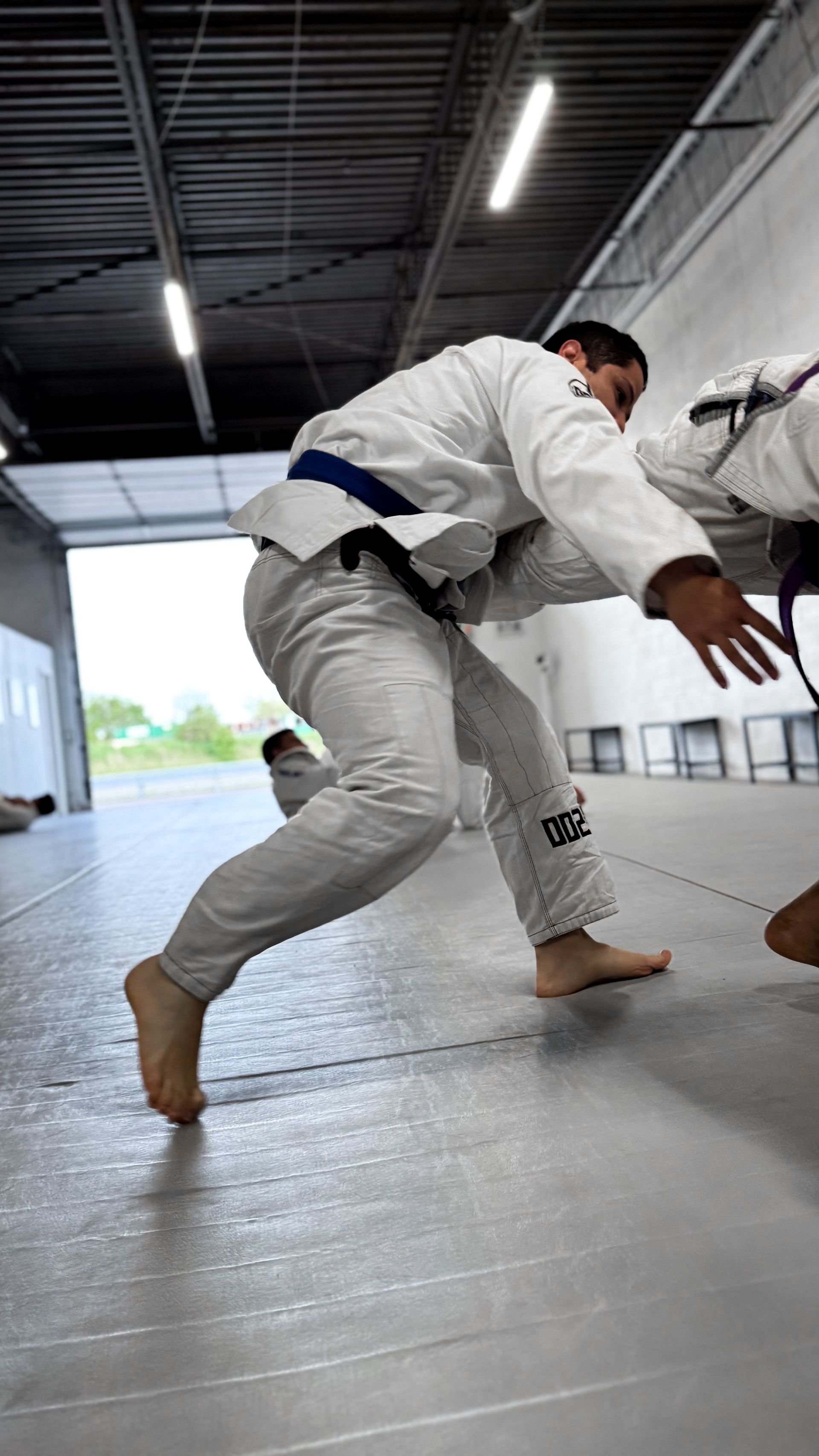 Students train Jiu Jitsu at Breathe Jiu Jitsu in Yaphank, NY, practicing calm breathing for stress.