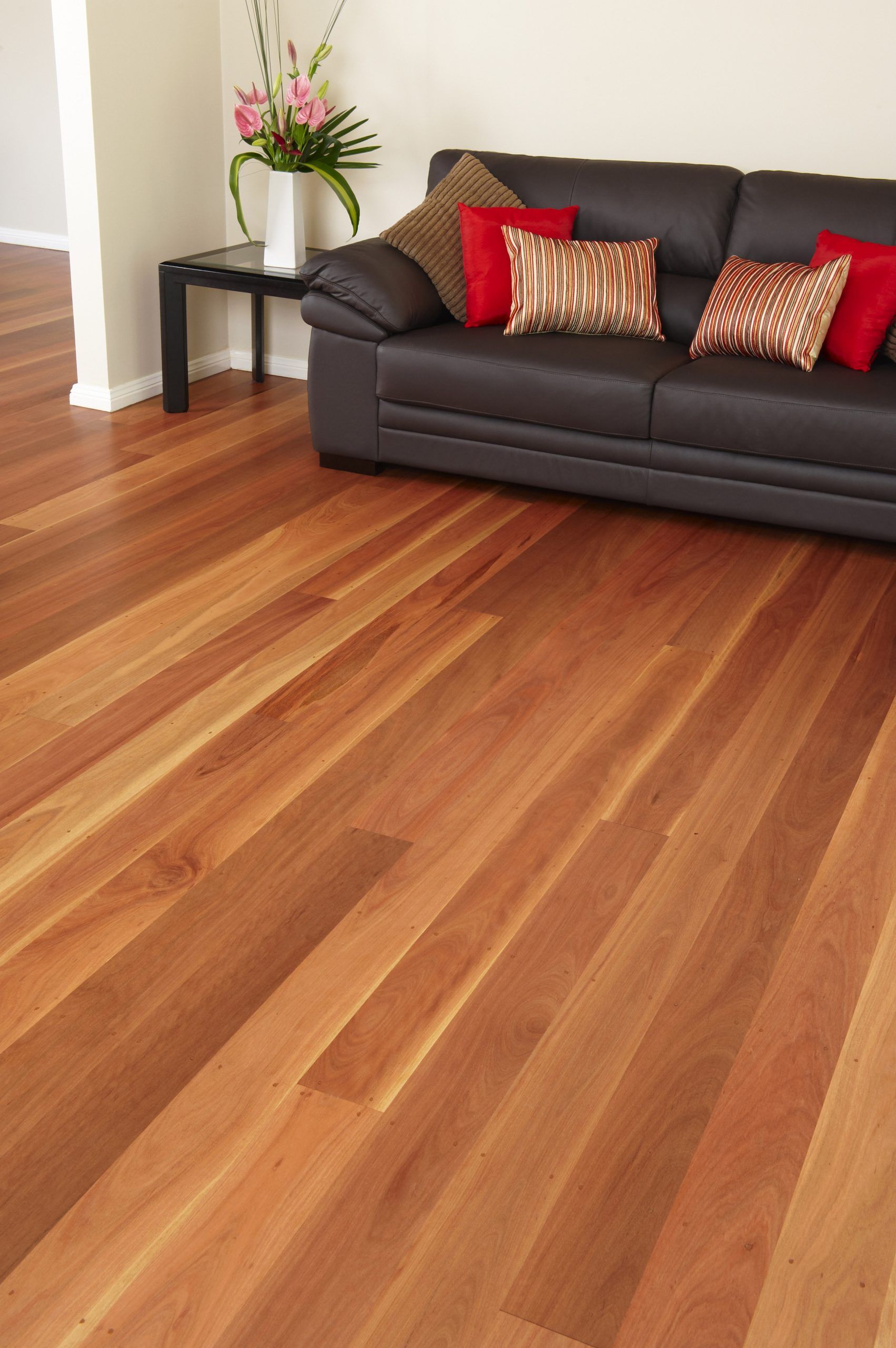 Wooden Flooring With A Brown Leather Sofa - Tony Di Milia Flooring