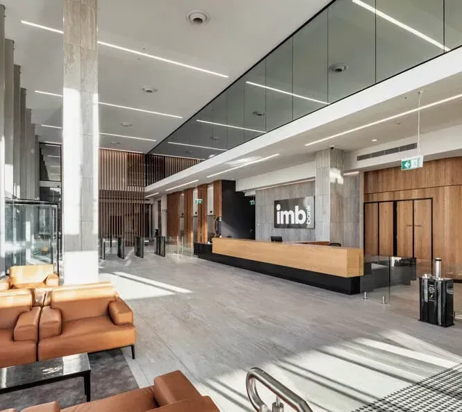 A Large Lobby with A Reception Desk — Tony Di Milia Flooring in Unanderra, NSW