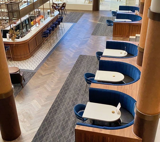 An Aerial View of A Restaurant with Tables and Chairs — Tony Di Milia Flooring in Unanderra, NSW