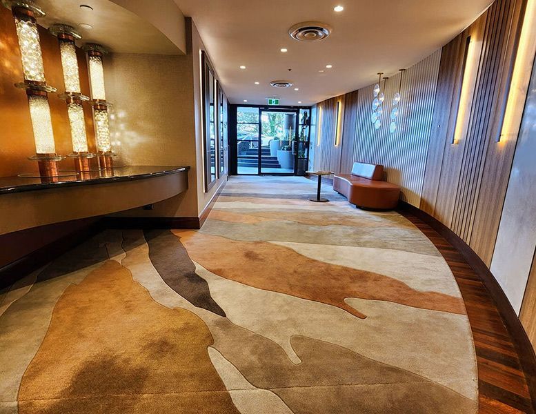 A Long Hallway with A Rug on The Floor — Tony Di Milia Flooring in Unanderra, NSW