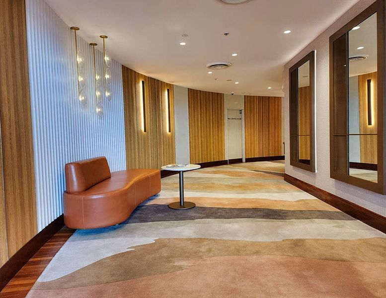 There Is a Couch and A Table in The Hallway — Tony Di Milia Flooring in Unanderra, NSW