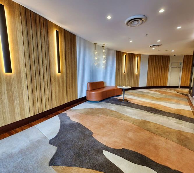 A Room with A Couch and A Table in It — Tony Di Milia Flooring in Unanderra, NSW