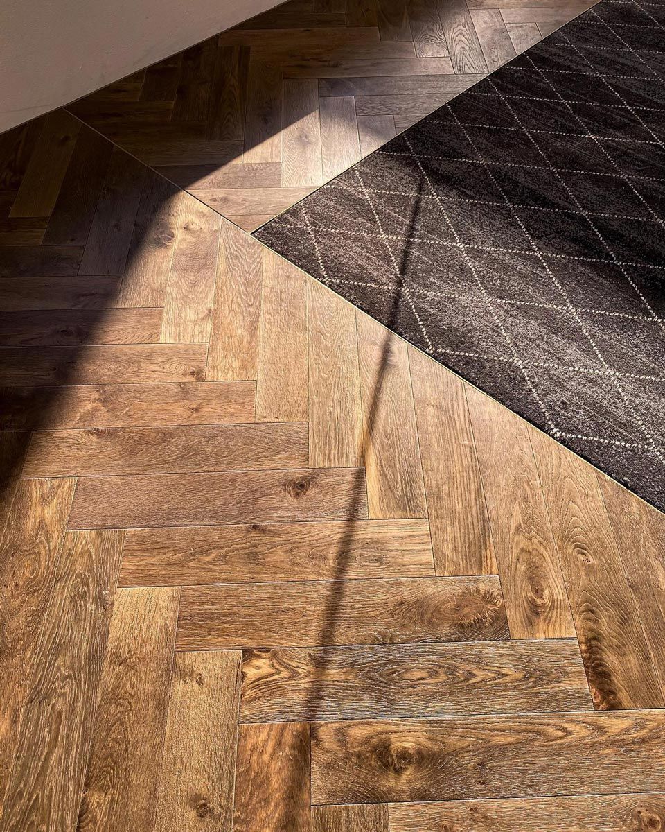 Wooden Flooring And A Carpet