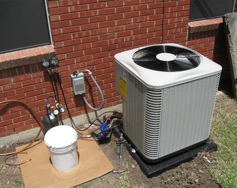 Air Heat Pumps Beside the House — Grandview, TX — Kingdom Air Conditioning & Heating