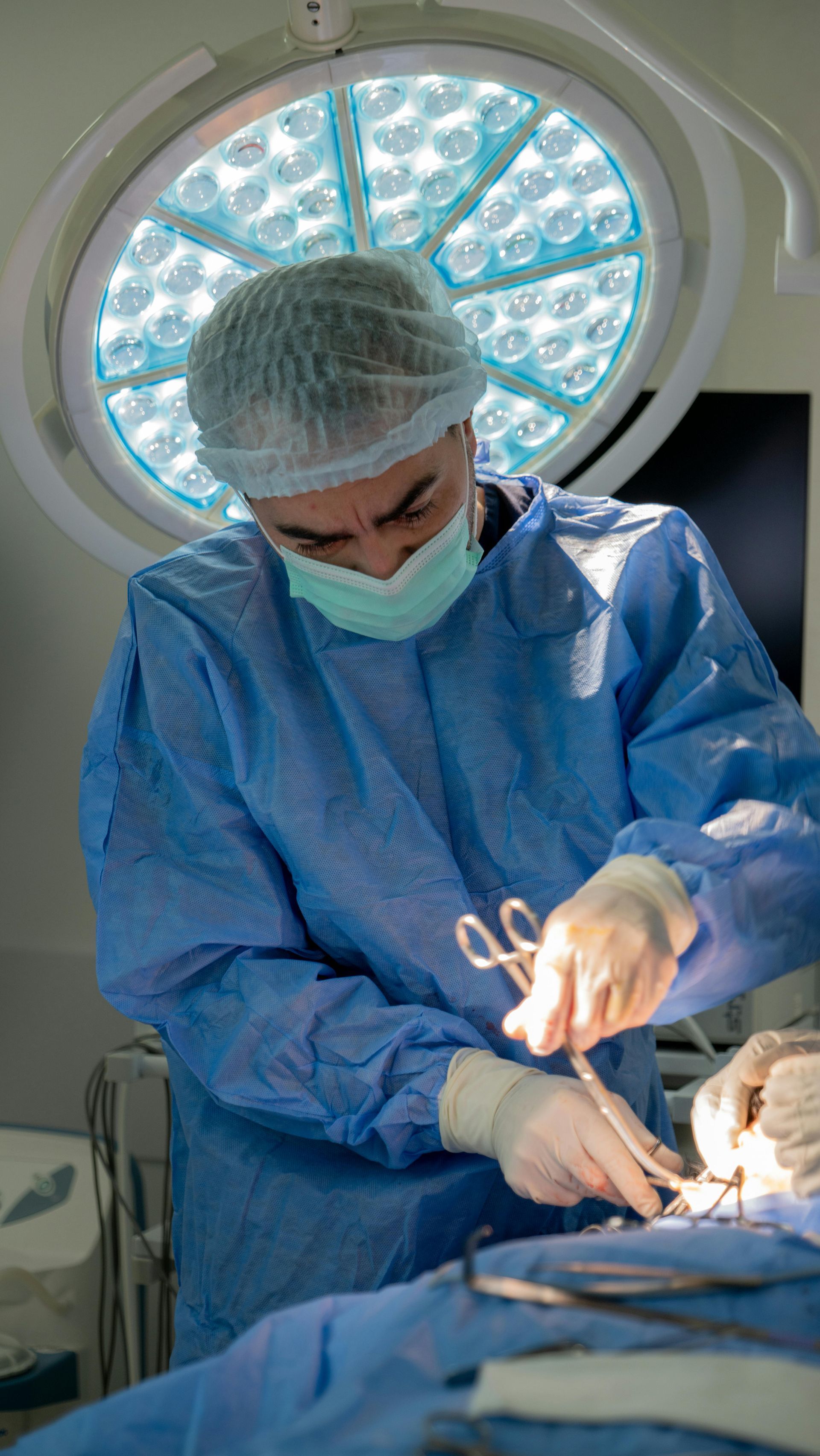 A Medical Professional In Blue Surgical Scrubs — URO - Urology Specialists in Double Bay, NSW