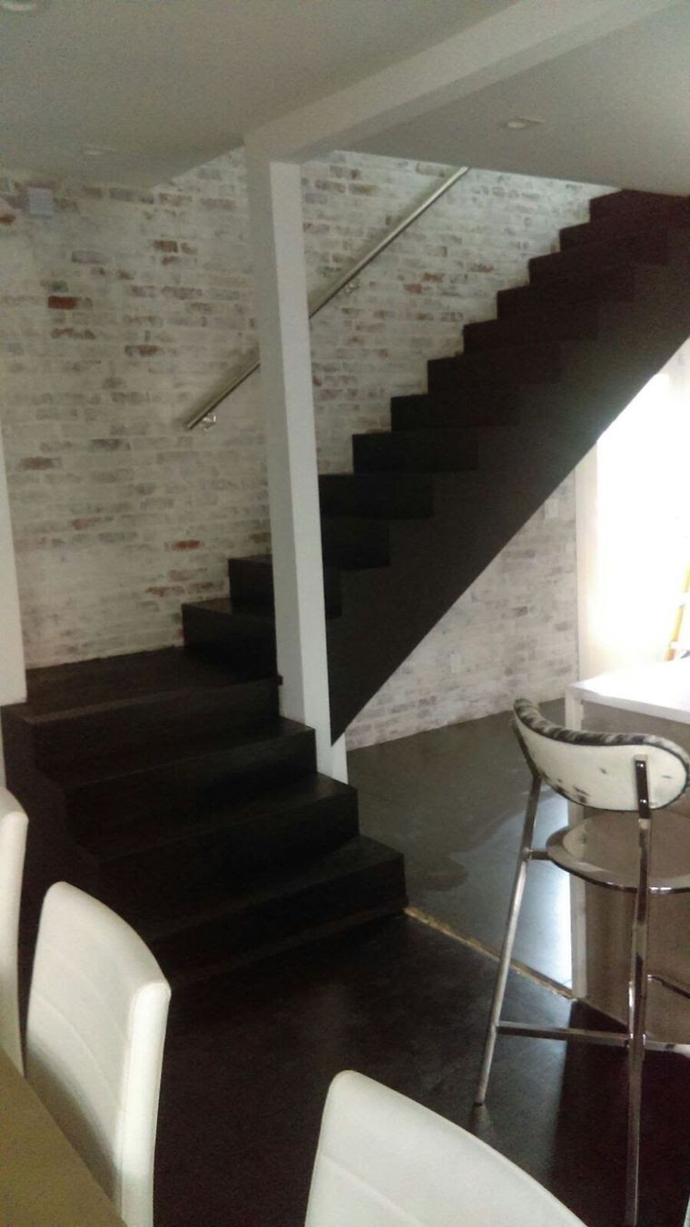 A staircase leading up to the second floor of a house