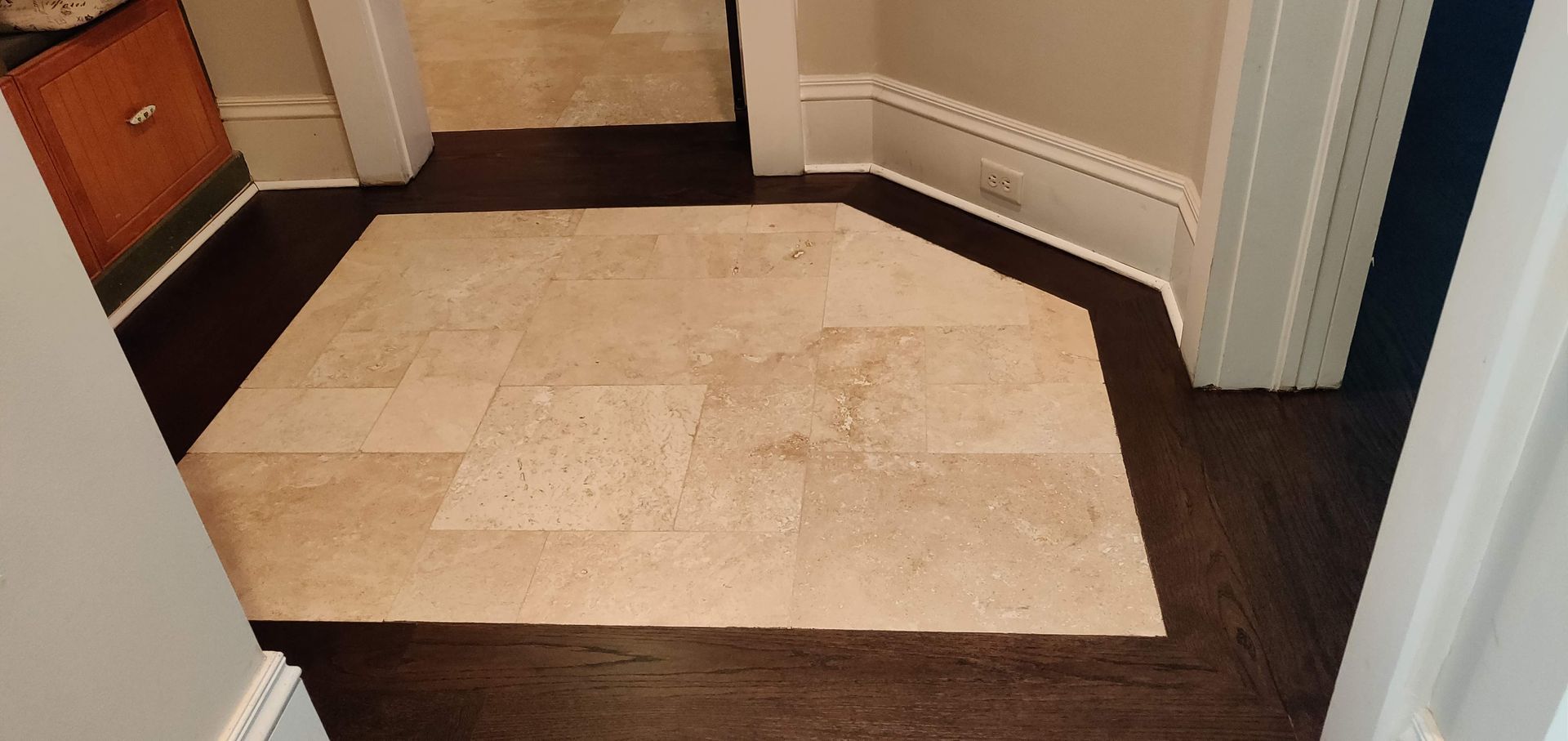 Hallway with a tile floor