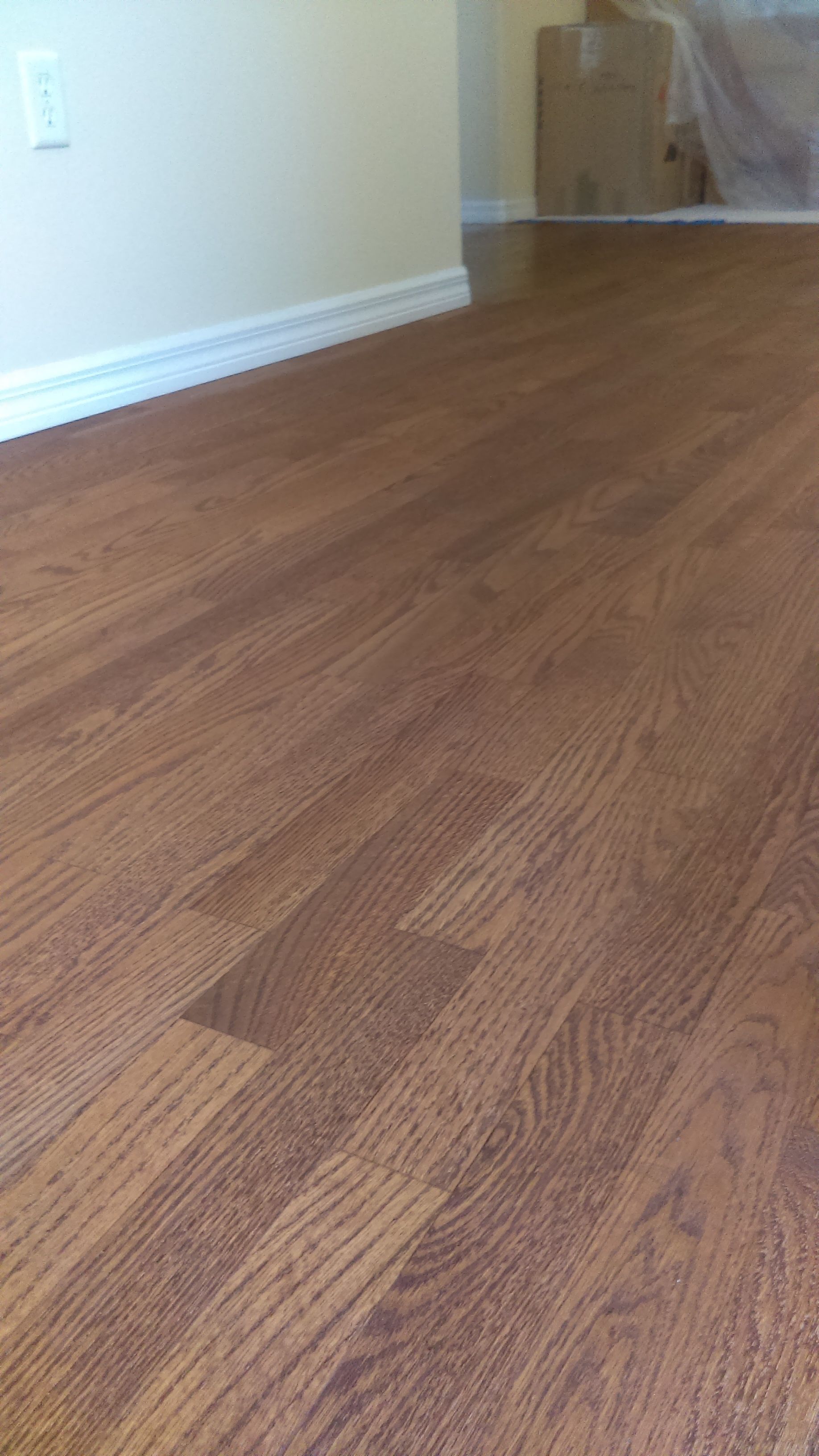 A close up of a wooden floor in a living room