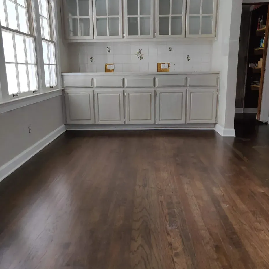 A kitchen with hardwood floors